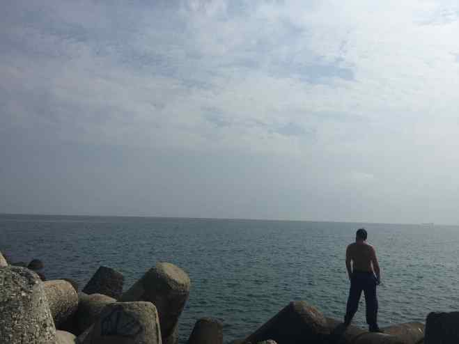 Climbing the pier into the Black Sea